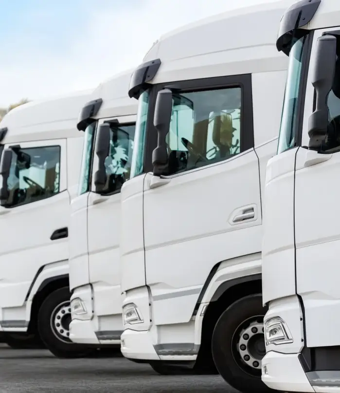 fleet-of-new-modern-electric-hybrid-hydrogen-or-diesel-white-trucks-parked-in-line-row-outdoors (1)