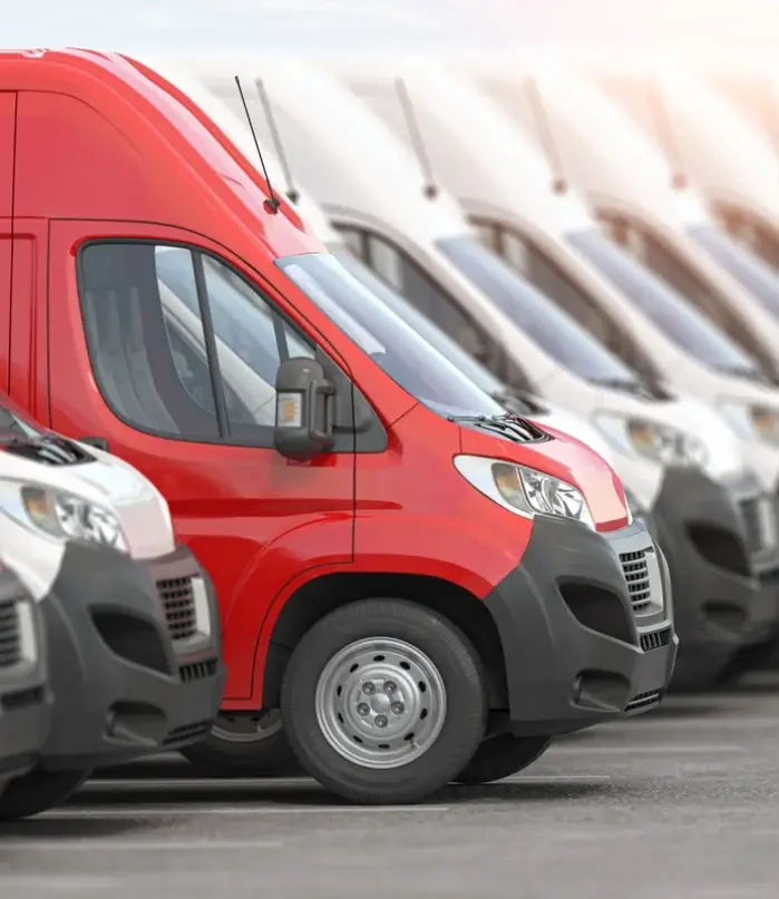 red-delivery-van-in-a-row-of-white-vans-best-express-delivery-and-shipemt-service-concept-